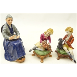  Royal Doulton figure 'The Cup of Tea' and a pair of Capodimonte figures of a girl and boy seated with a dog and cat, with certificates (3)  