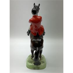 A Beswick model of a huntsman on rearing horse, model no 868 2nd edition, with printed mark beneath, H25cm. 