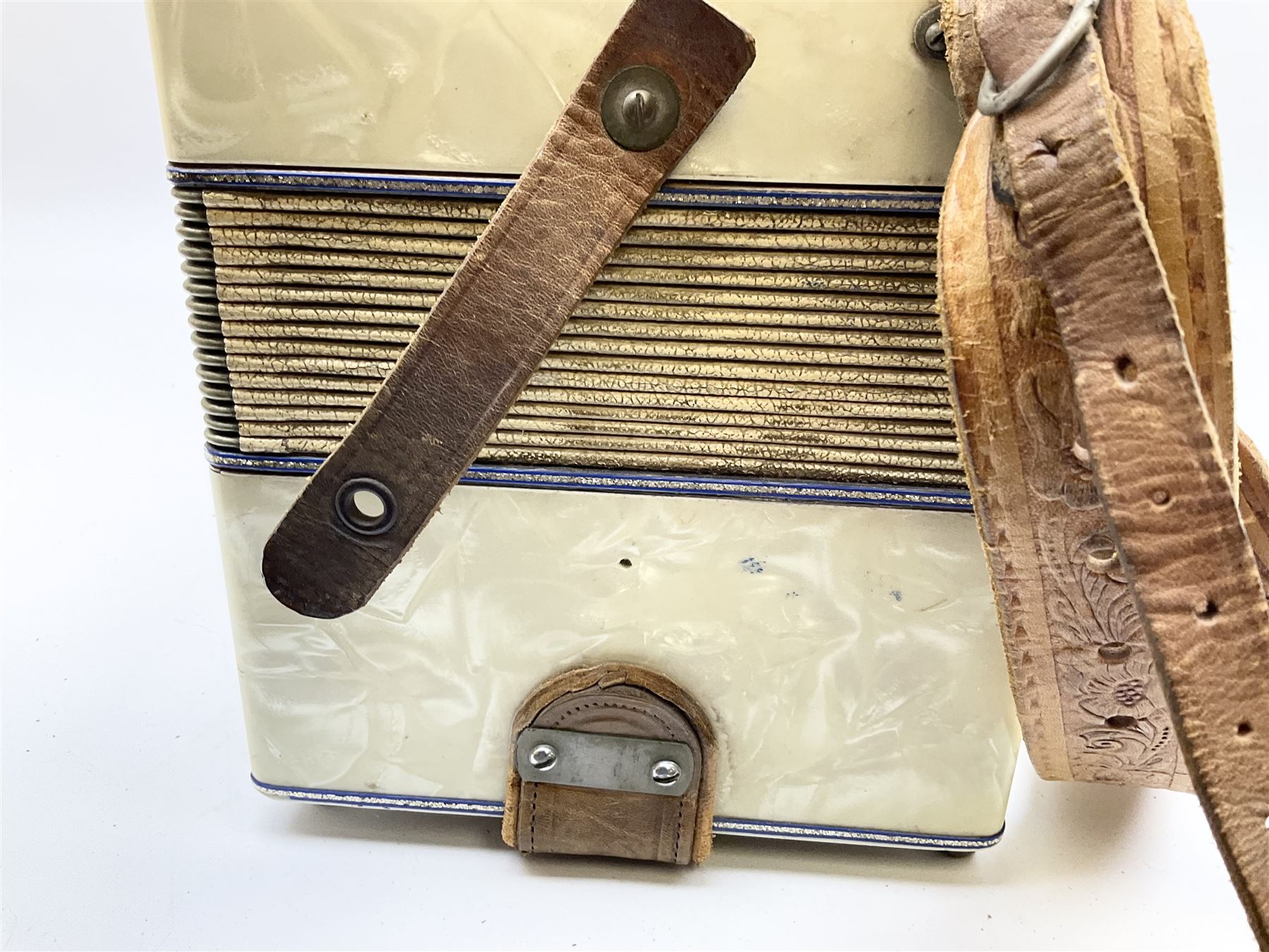 Italian Lambardi piano accordion in ivory coloured pearline case with jewelled decoration, twenty keys and one-hundred and twenty buttons L 37cm