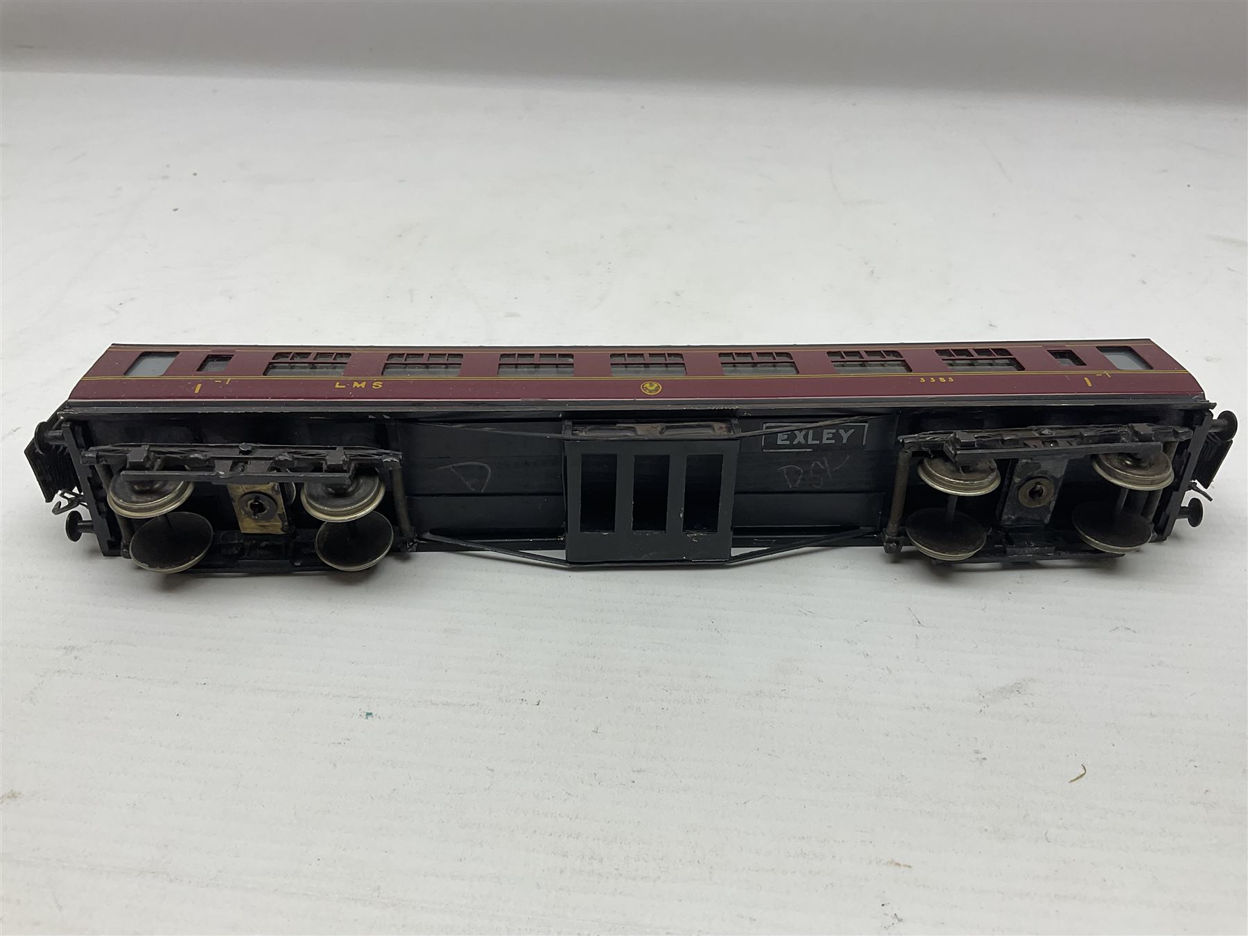 Exley '00' gauge - fourteen various coaches comprising four LMS maroon (3322 3rd, 2202 3rd, 6665 3rd and 388 Sleeping Car 3rd), LNER green/cream Buffet Car 21419, LNER teak 8639 1st, Southern green 6688 3rd, GWR brown/cream 3322 3rd, LNER 206 3rd, LNER 319 1st/3rd, SR green 351 3rd, SR green 188 Parcel Van, GWR 331 3rd and GWR 362 3rd; all unboxed (14)