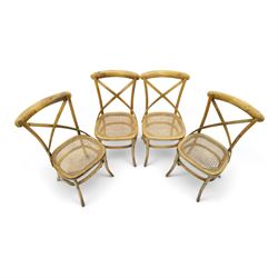 Set of four Oka style rattan dining chairs, bentwood frames inset rattan seat