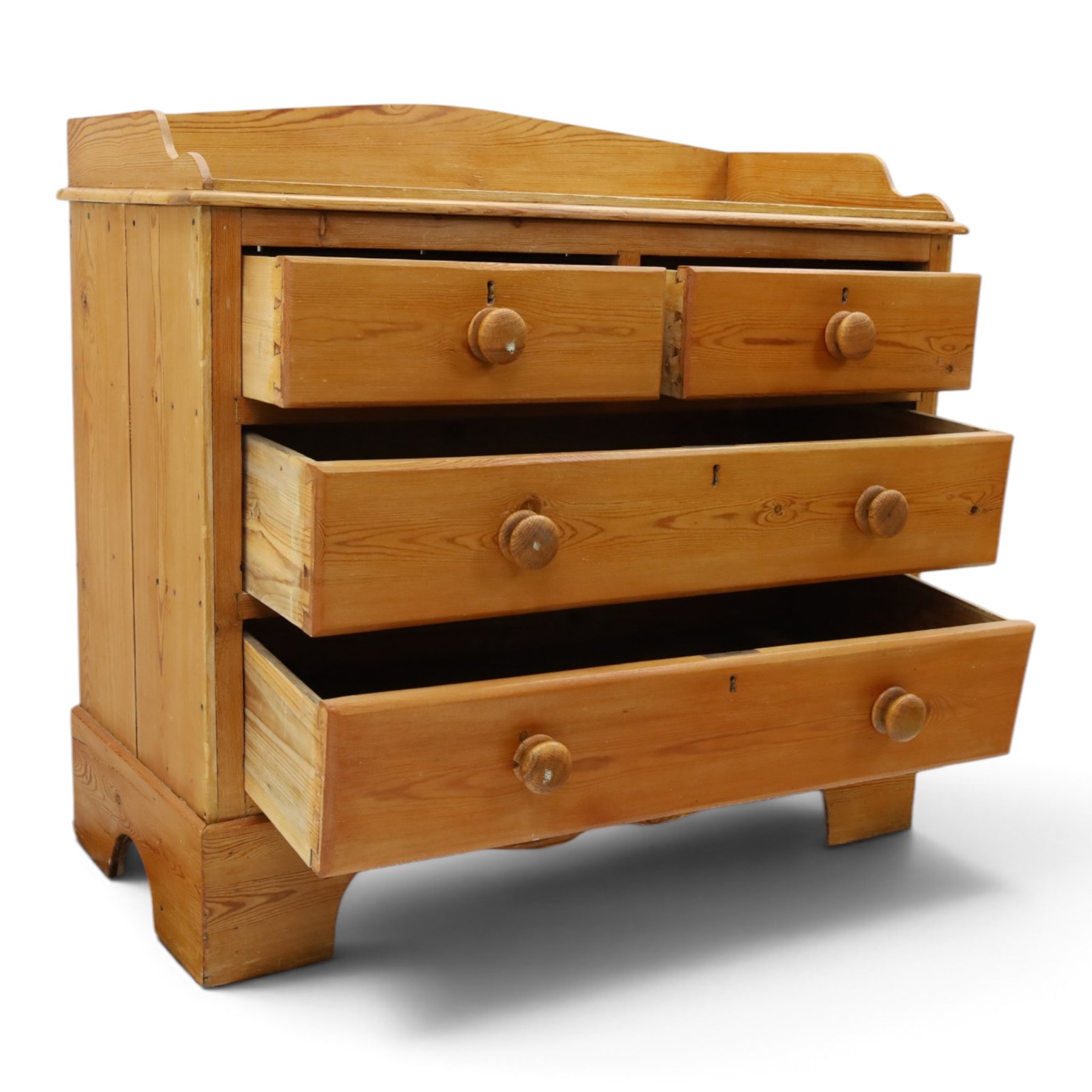 Victorian pine chest, galleried three quarter top, fitted with two short and two long drawers. with shaped apron and supports