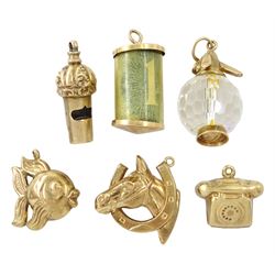 Six 9ct gold charms including horse's head and shoe , fish, whistle, telephone, crystal soda syphon and money roll