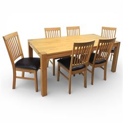 Solid light oak extending dining table with single leaf, and set of six chairs