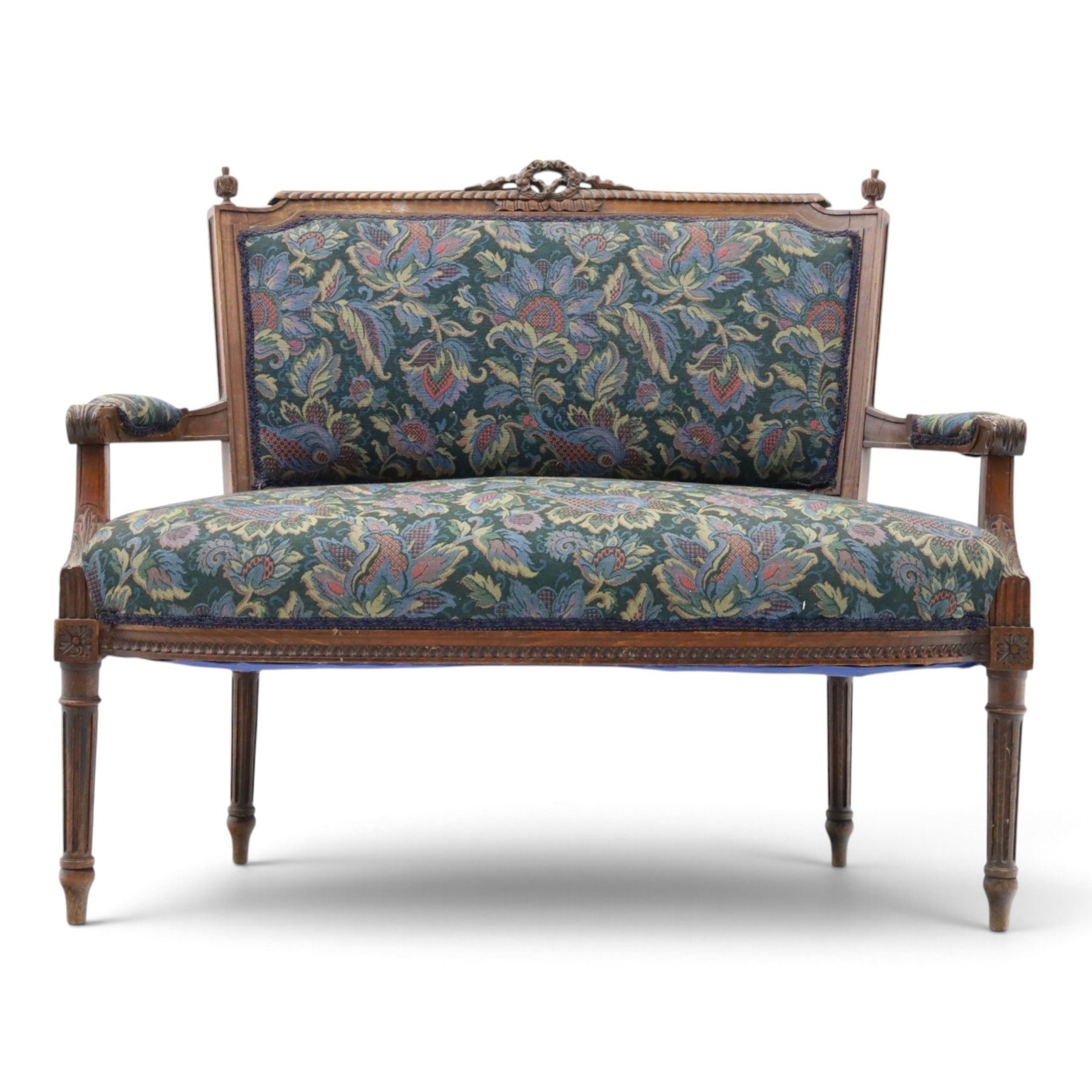 20th century French Louis XVI style stained beech two-seat salon settee, rectangular upholstered back and seat in floral tapestry fabric, carved and moulded frame with foliate cresting, padded open arms and fluted tapering supports