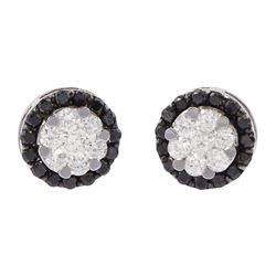 Pair of 18ct white gold black and white diamond circular stud earrings, stamped 750