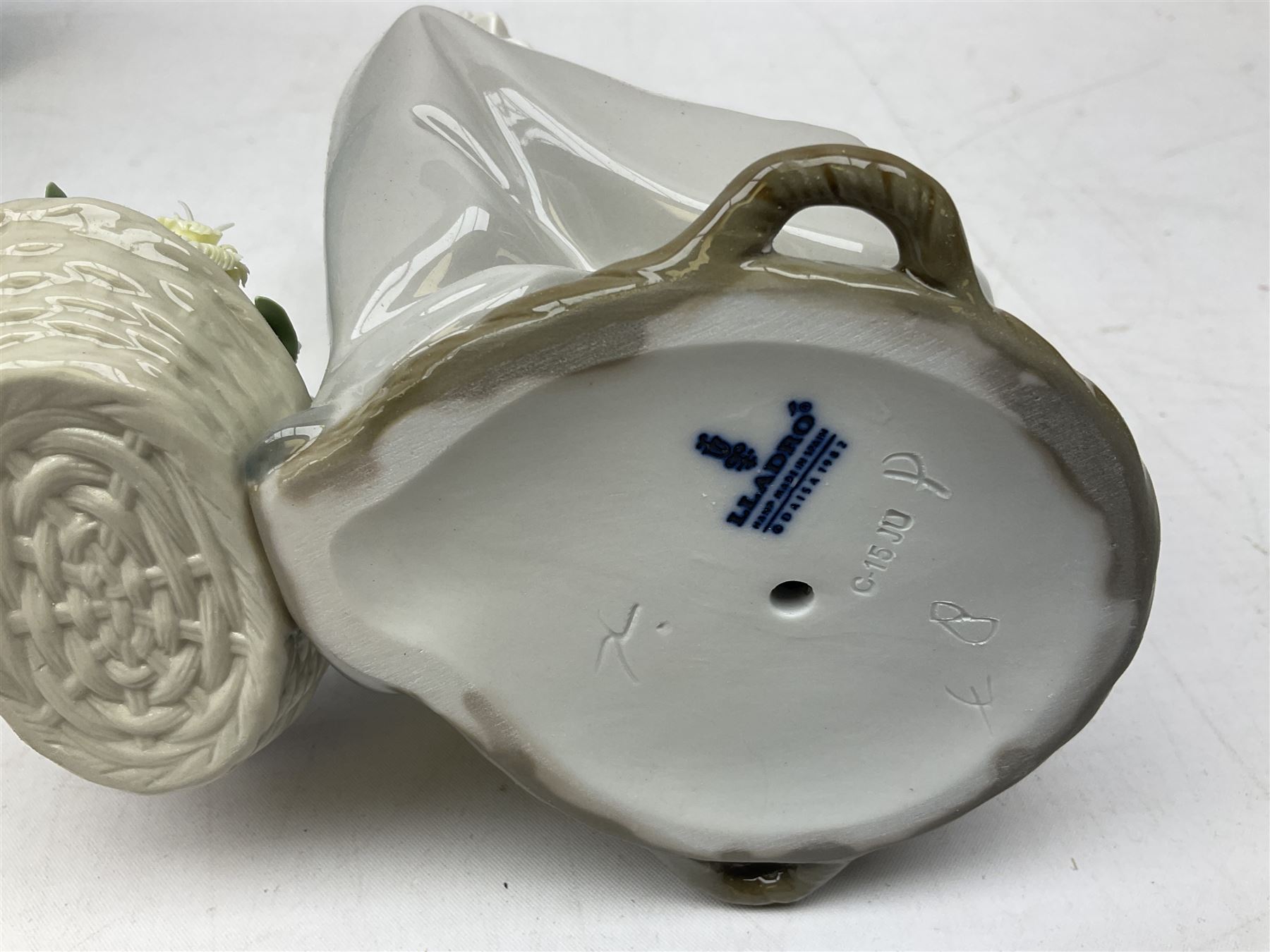 Three Lladro figures, comprising Pondering, no 5173, Nostalgia, no 5071 and Nature's Bounty, no 1417, all with original boxes, largest example H27cm