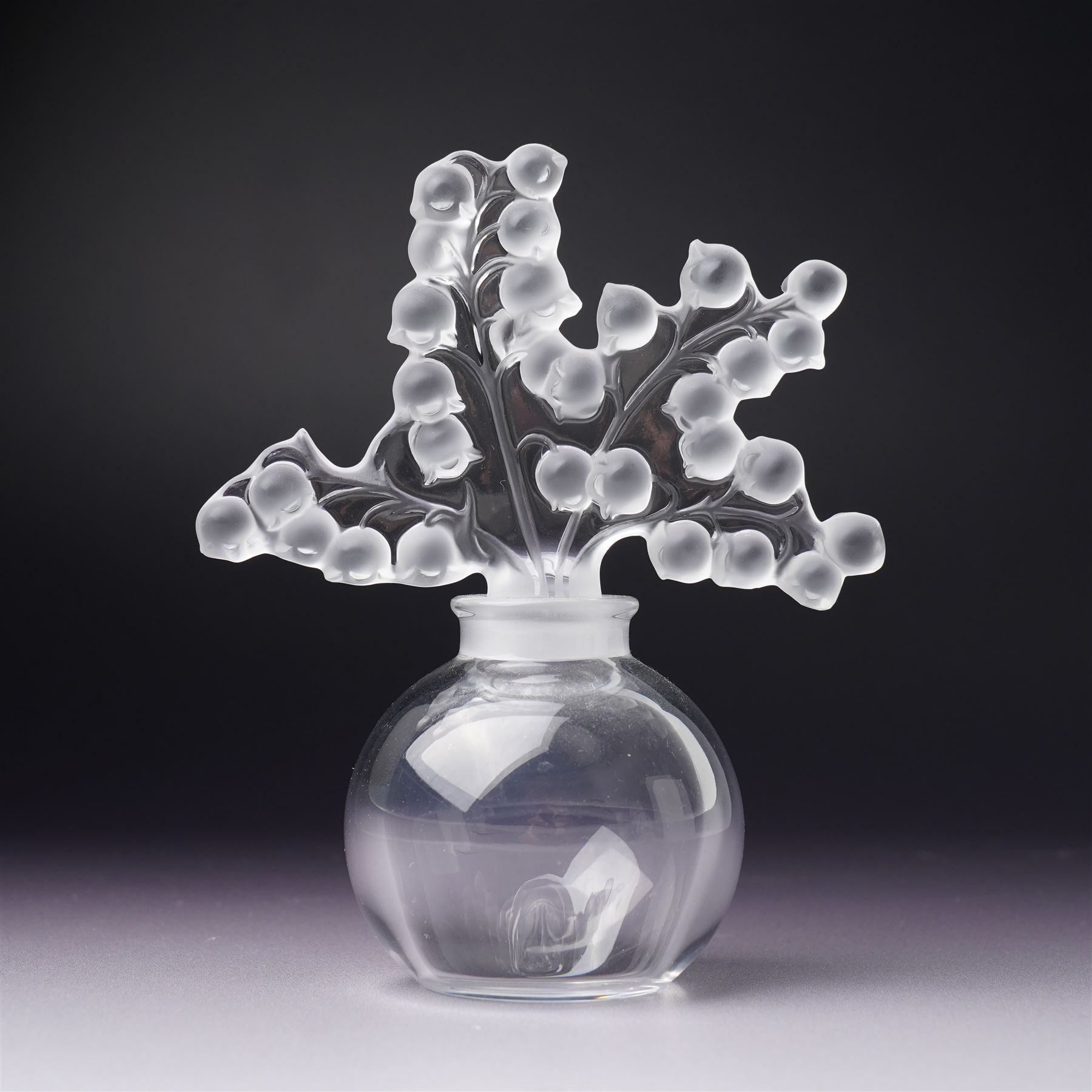 Lalique clear glass ' Clairefontaine' scent bottle with frosted glass stopper H12cm and another Lalique 'Folie' scent bottle  with arc tiara stopper H10cm both inscribed 'Lalique, France' (2)