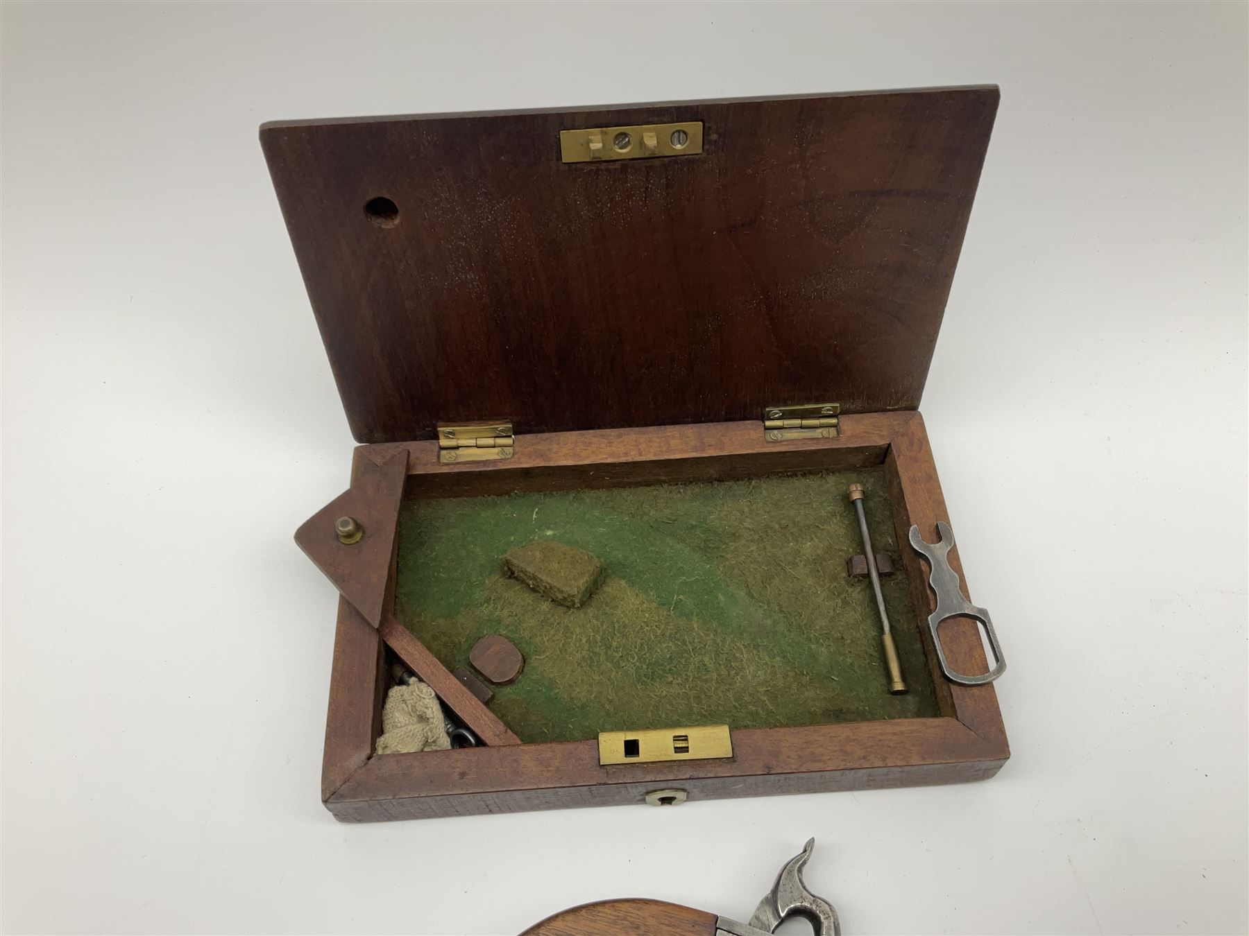 Scratch-built copy of a 19th century percussion cap pistol with 7cm tapering cannon style turn-off barrel, lock-plate inscribed 'F. Fox' and mahogany bag stock L17.5cm overall, in fitted mahogany box with inlaid crest chased mother-of-pearl cartouche and double-ended spanner