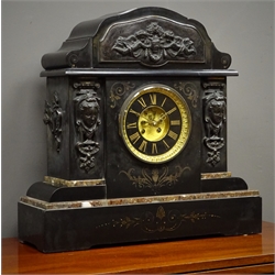  Large 19th century black slate and marble mantle clock, shaped pediment with metal mount depicting putti and floral urn, black chapter ring with gilt Roman numeral, visible brocot escapement, enclosed by mask mounts, engraved decoration, twin train movement stamped 'Samuel Marti, Medaille de Bronze', striking on coil, H49cm  