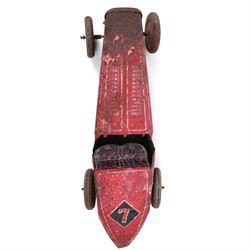 Mettoy tinplate clockwork racing car, the boat tailed red body with lithographed details, racing no. 7, with Dunlop Fort tyres, for restoration, H8cm, L32cm