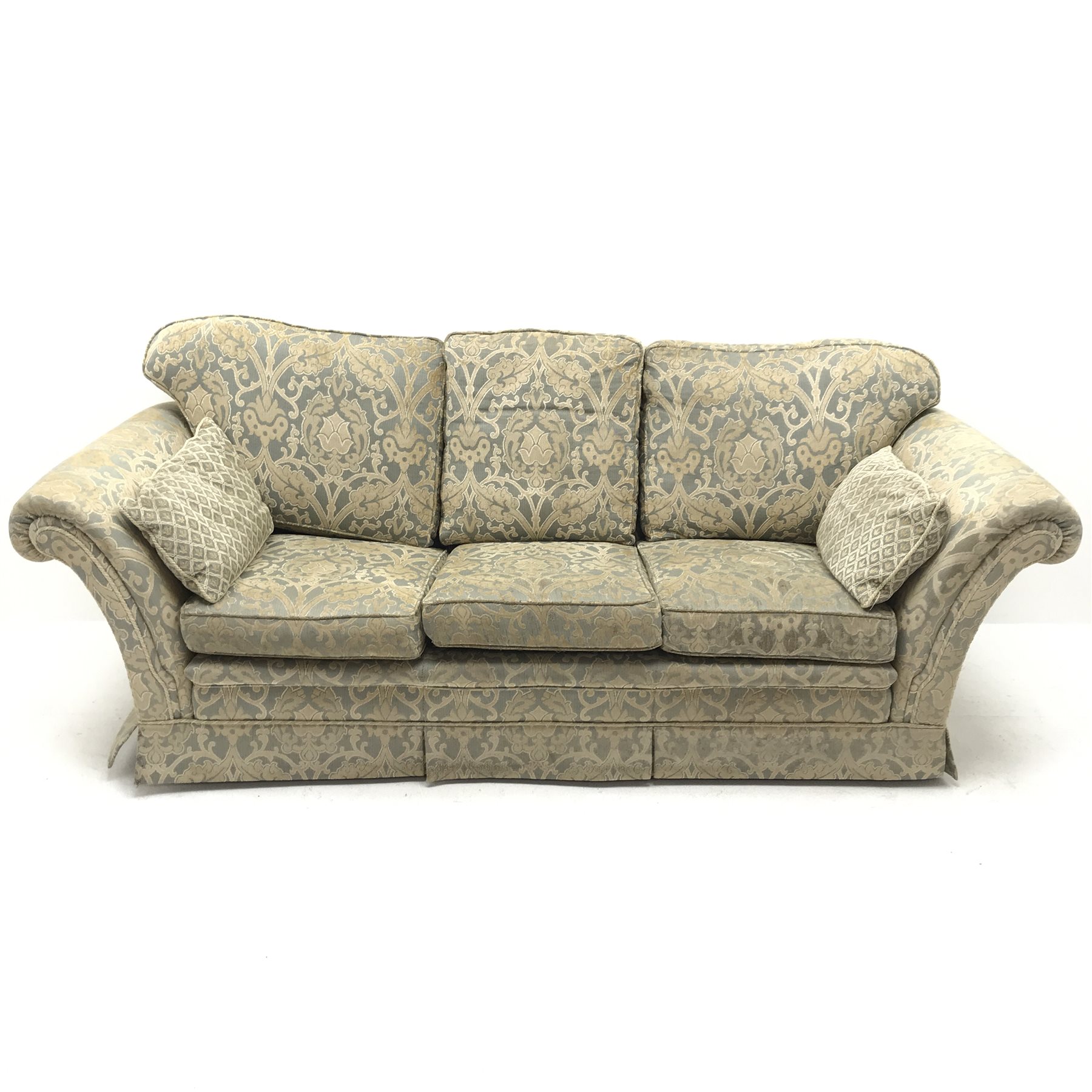 Three seat sofa upholstered in a floral patterned gold and teal fabric