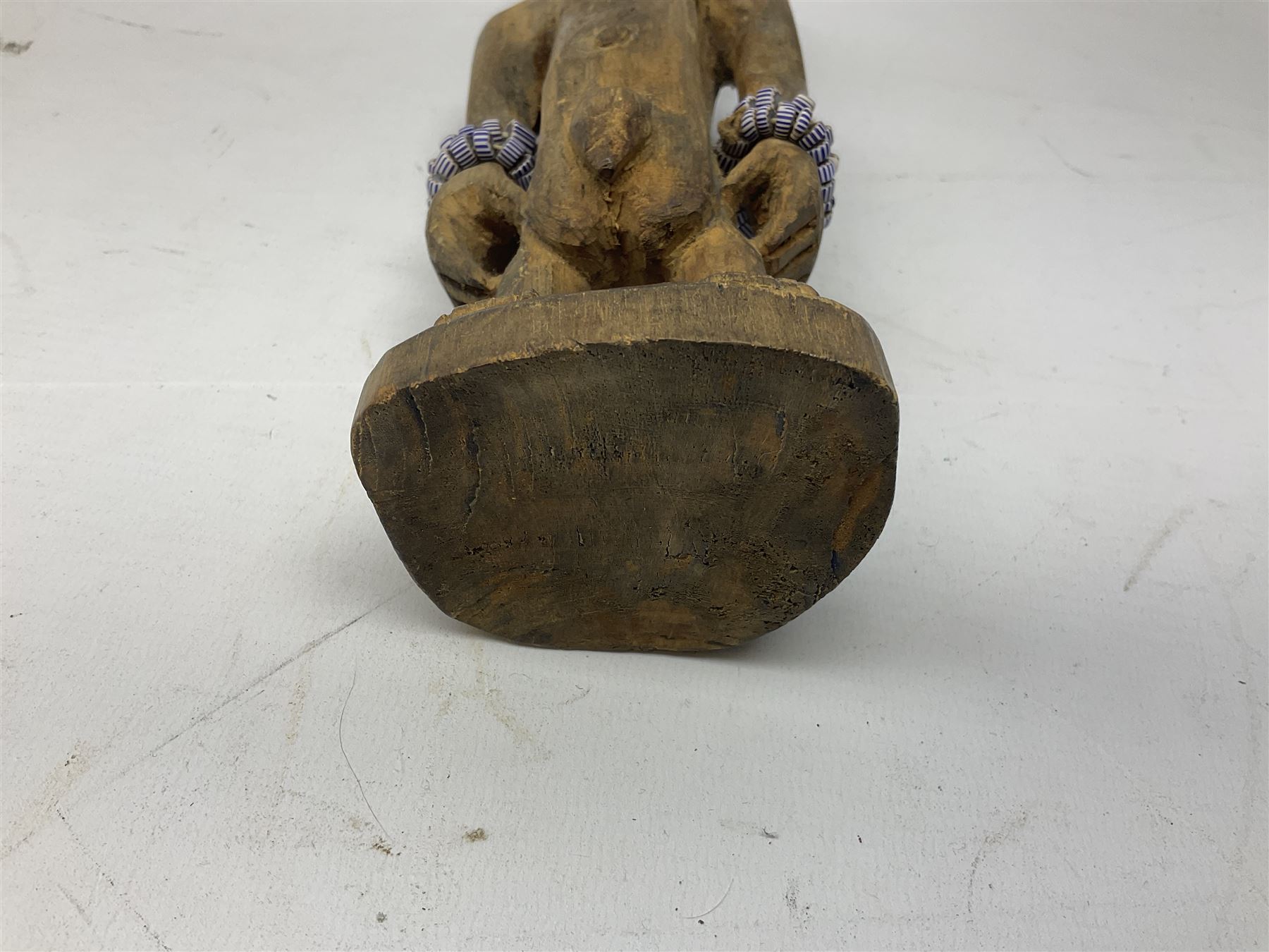 Early 20th century West African Yoruba family wooden figure of Orisha Oko, the god of farming/agriculture, carved from the solid, bears manuscript label of provenance verso H26.5cm