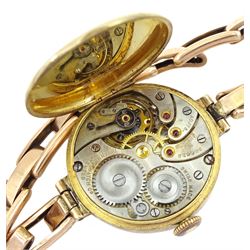Early 20th century 9ct rose gold ladies manual wind wristwatch by Tavannes Watch Co, Glasgow import marks 1928, on rose gold expanding link bracelet, stamped 9ct