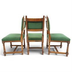 17th century style mahogany set of six dining chairs, with carved scrolled finials, padded green velvet upholstery, block and turned supports united by stretcher  