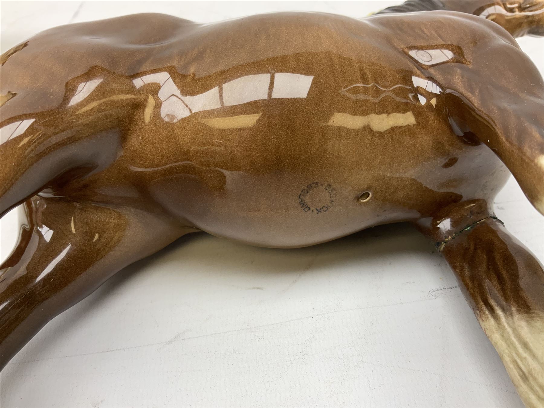 Three Beswick models comprising Hereford Bull no 949, 'CH Cutmil Cupie' Pug, and bay Shire horse, all with printed marks beneath