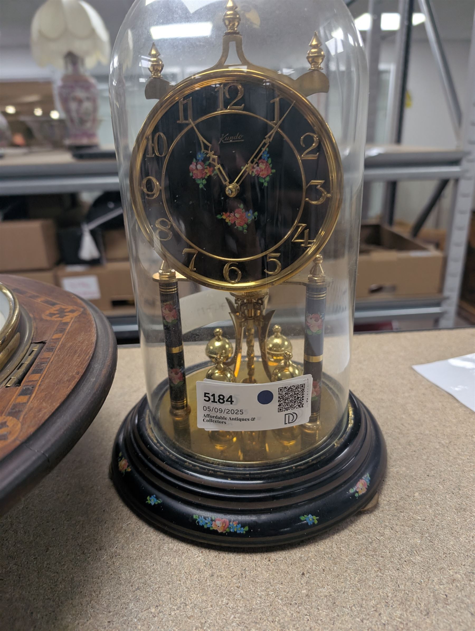 American-Victorian walnut drop dial wall clock with parquetry inlay, c1880, 8-day timepiece movement and a Kundo 1960’s torsion clock with a skeleton movement and four ball oscillating pendulum, with a glass dome. Torsion spring intact.