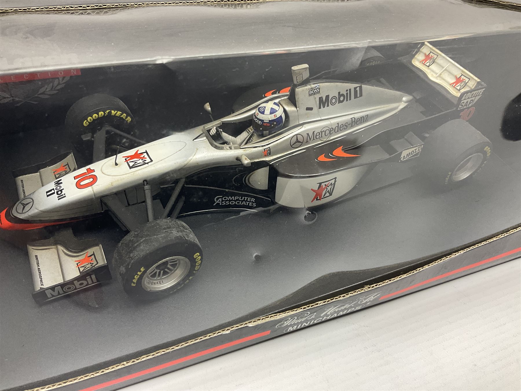 Four Minichamps 1:18 scale die-cast racing cars - Williams F1 Team BMW FW26 R. Schumacher; McLaren Mercedes MP4-12 D. Coulthard; McLaren Mercedes MP4-13 M. Hakkinen; and Formel 1 Jordan peugeot EJR 195 E. Irvine; all boxed (4)