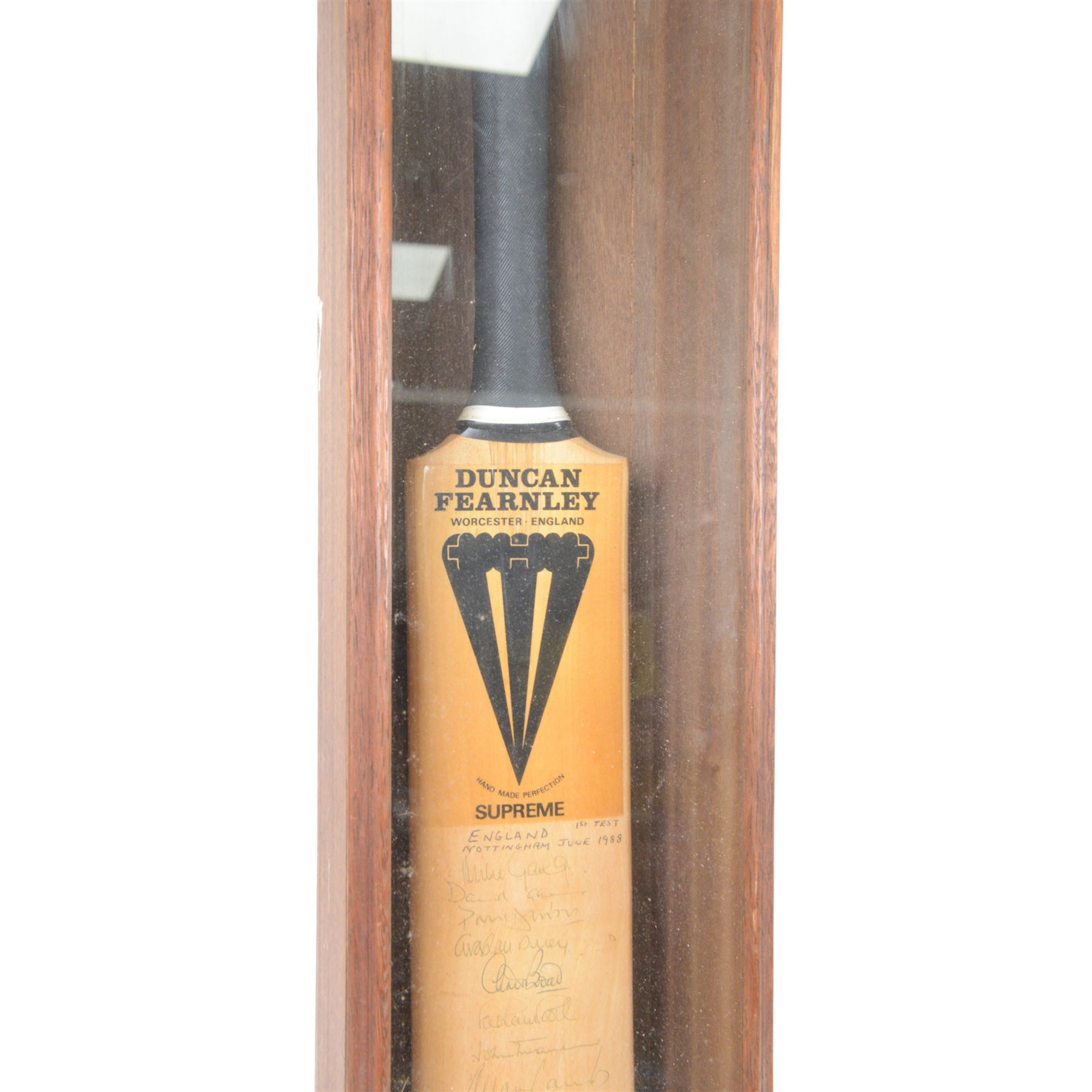 Duncan Fearnley cricket bat, signed by the 1988 England vs West Indies cricket teams from the 1st test match with players signatures including Mike Gatting, Allan Lamb, David Gower, Graham Gooch, Viv Richards and Curtly Ambrose, contained within a glazed wooden display case, H100cm