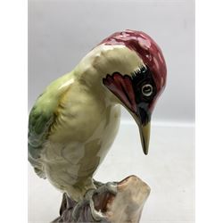 Three Beswick figures of birds, comprising pheasant no 1225, magpie no 2305 and woodpecker 1218, all with impressed marks beneath, tallest H22cm
