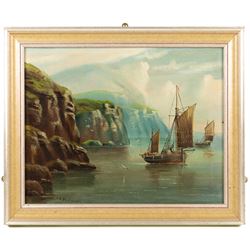 Edward King Redmore (British 1860-1941): Boats Sailing off a Rocky Coast, oil on canvas signed 37cm x 47cm