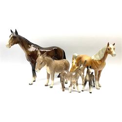 A collection of Beswick figures, comprising  Donkey model no 2267a, Donkey foal model no 2110, brown gloss foal model no 997, brown gloss horse model no 1992, palomino foal model no 763 (3rd version), and palomino horse model no 1265.  