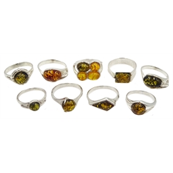 Nine silver Baltic amber rings, stamped or tested