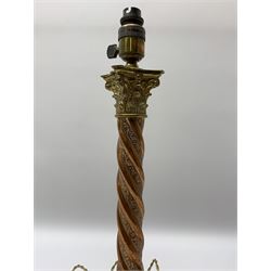 Early 20th century brass and copper Corinthian column table lamp, the square stepped brass base leading to a spiral twist copper column and brass Corinthian capital, H44.5cm 