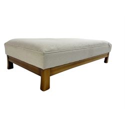 Large rectangular stained beech footstool upholstered in cream fabric