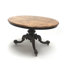  Victorian walnut oval tilt-top salon table with quarter veneered burr walnut top, turned column on four scrolling supports on castors, W98cm, H72cm, D98cm  