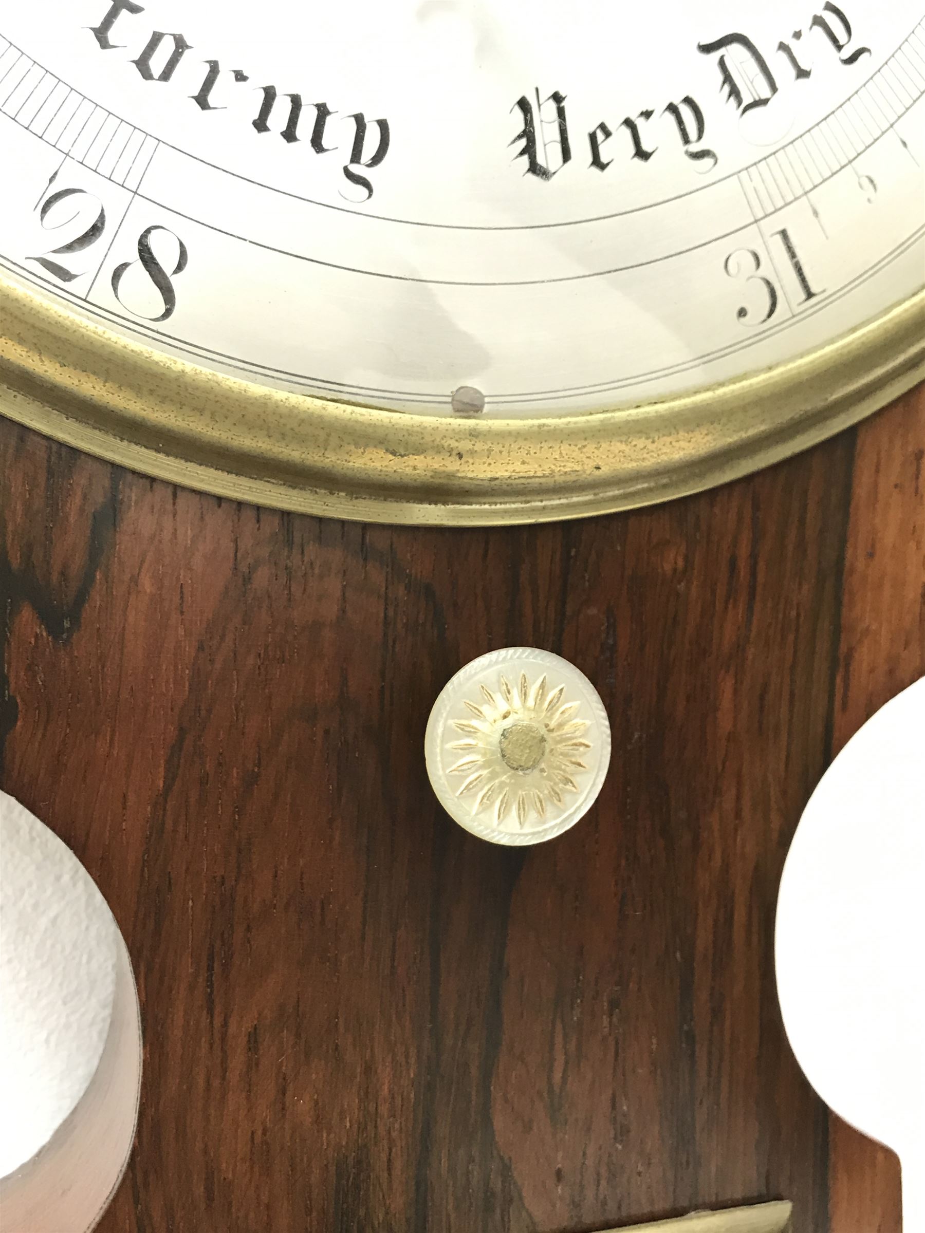 Early 19th century rosewood four dial banjo barometer, dry/damp dial, mercury thermometer, silvered circular register engraved with urn and scroll decoration, balance signed 'Vassalli Scarborough', fitted with mother of pearl adjusting handle