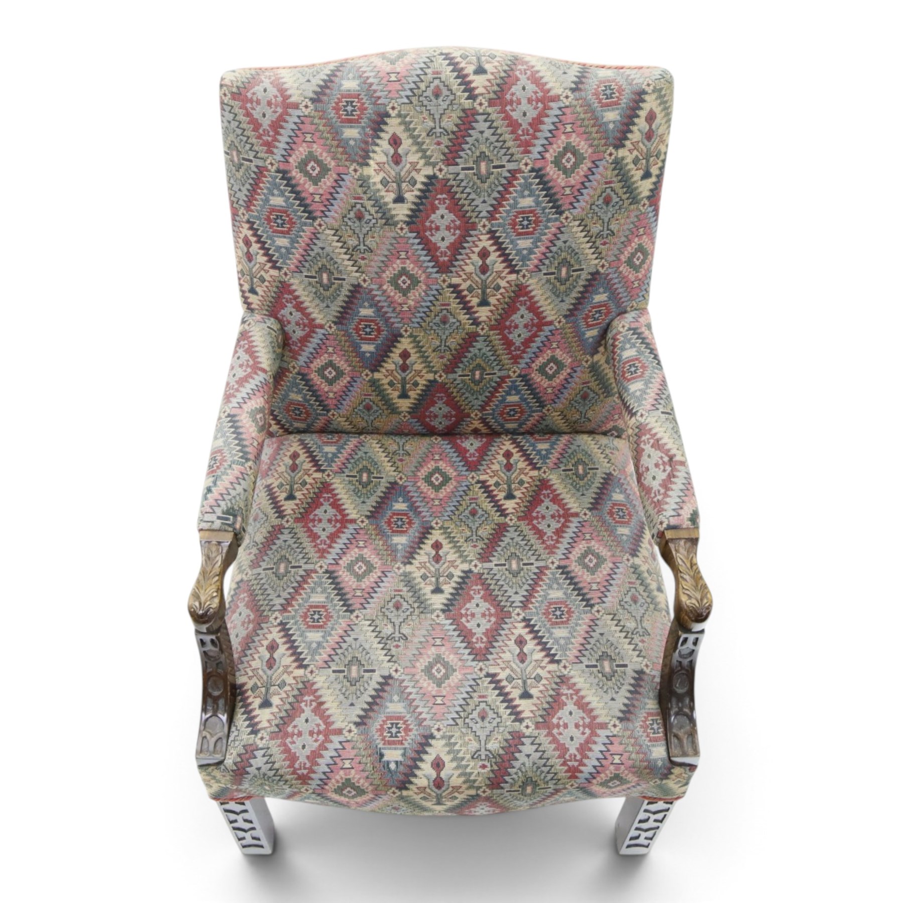Chippendale design Gainsborough elbow chair, upholstered in kilim fabric, blind fretwork and acanthus carving