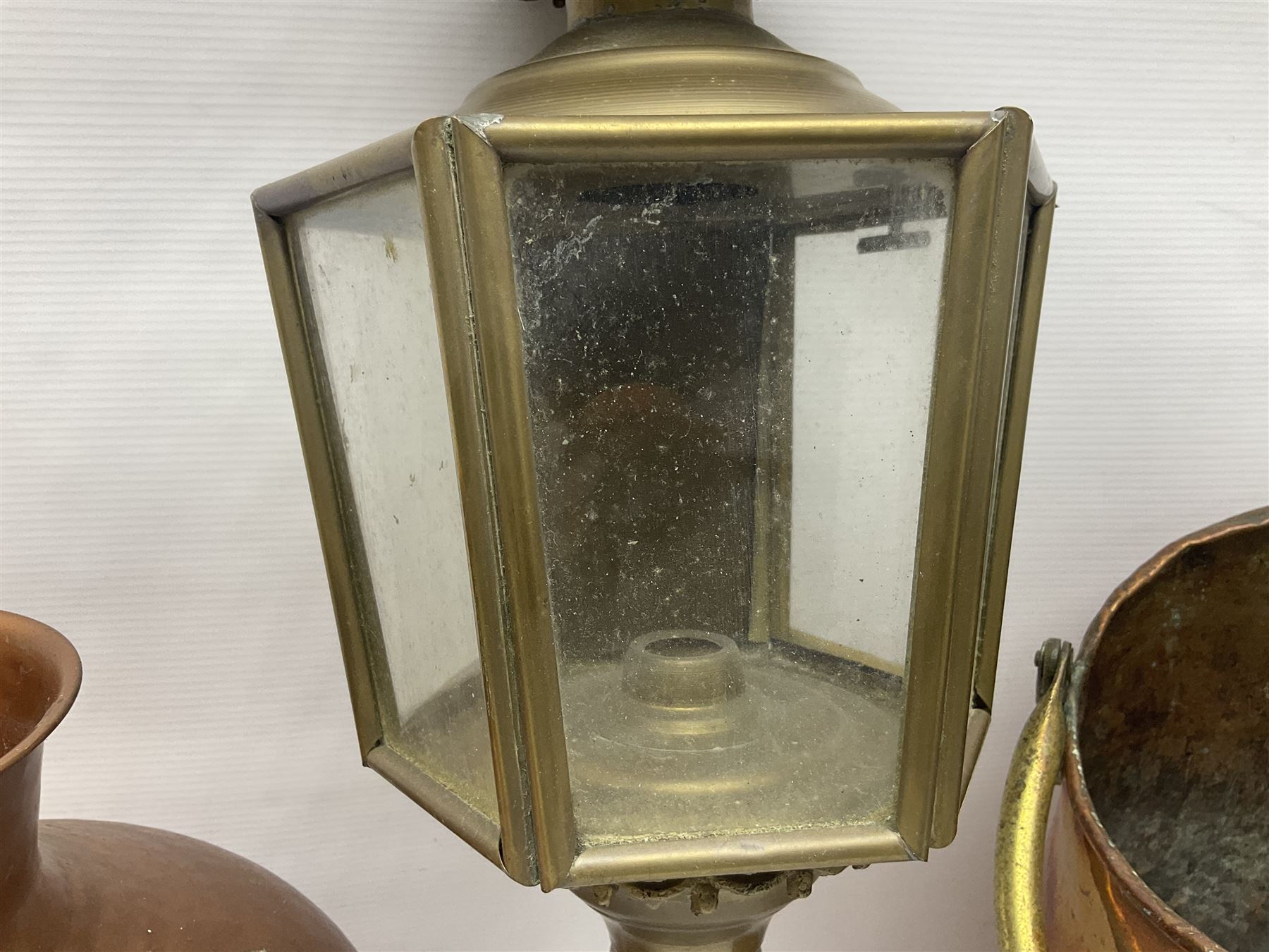 20th century brass carriage lantern, with six glass panels and eagle finial, together with a copper coal scuttle and hammered copper vase, lantern H77cm