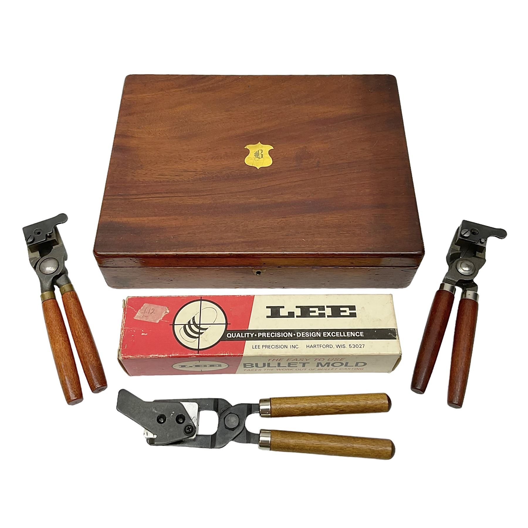 Three modern bullet moulds comprising Lee double cavity .44 calibre, boxed with instructions; and two Lyman .38 calibre; all in unrelated 19th century mahogany box