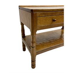 Mouseman - circa. 1950s oak serving table, adzed rectangular top over two drawers, on octagonal supports joined by adzed undertier, the rear right leg carved with mouse signature, by Robert Thompson of Kilburn