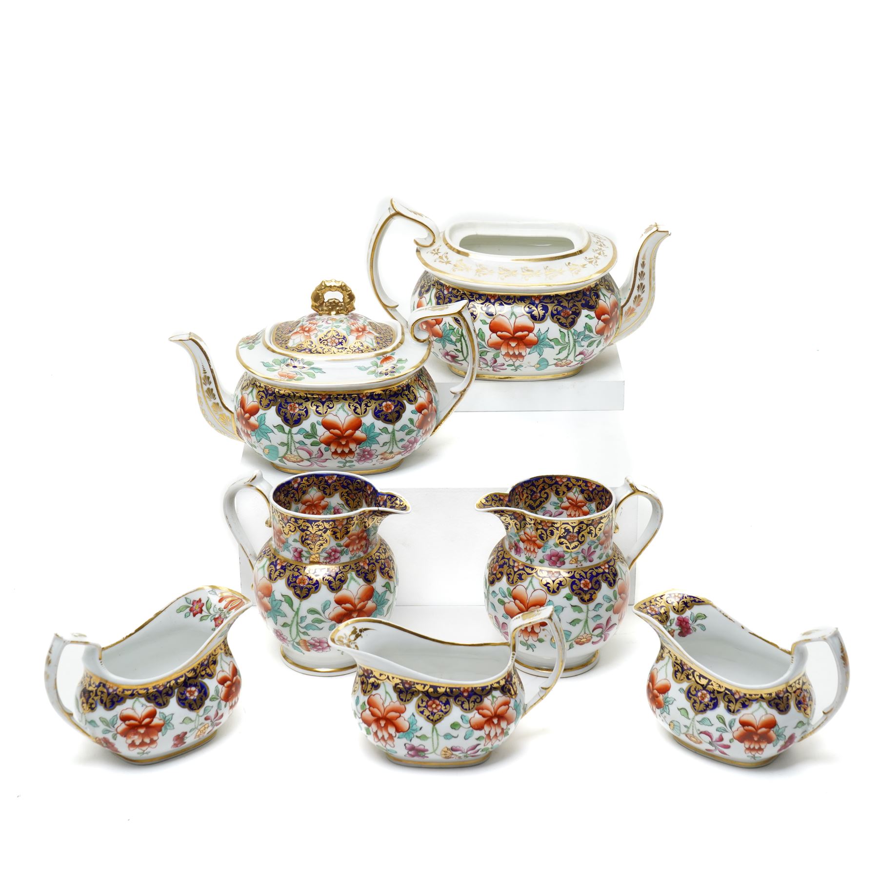 Number of early 19th century Chamberlain's Worcester pattern items decorated with Japanese flowers comprising pair of milk jugs, three sauce boats and two teapots, unmarked 
Provenance: property of a Nobleman