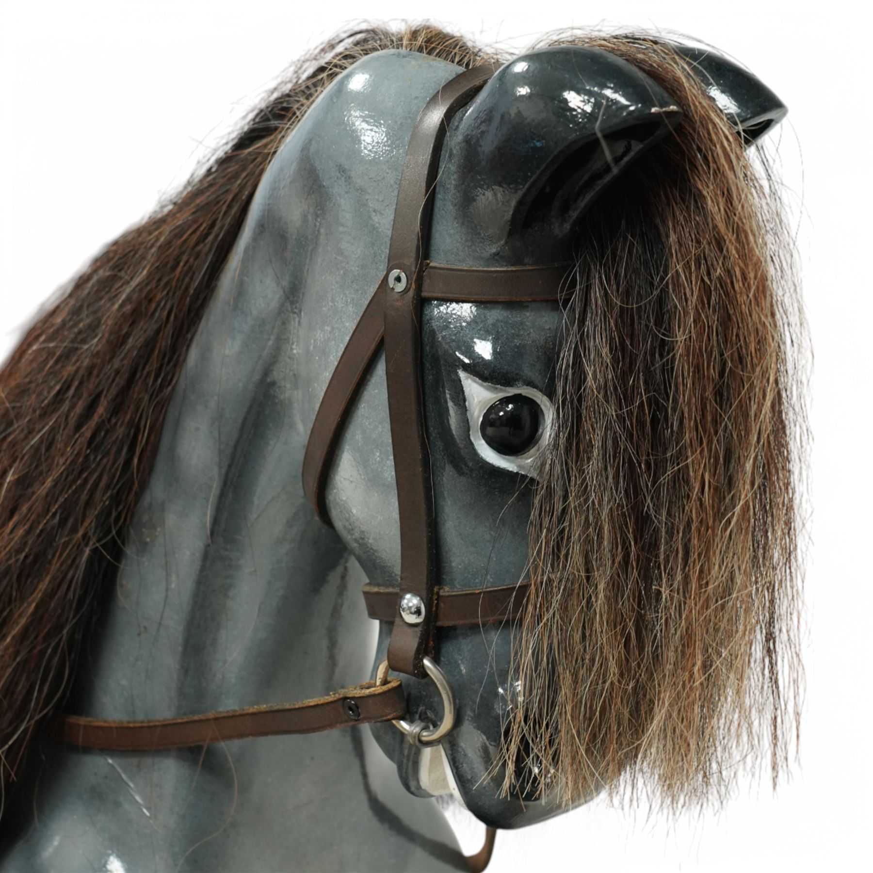 Wooden rocking horse, in Dapple Grey paint finish with reins and stirrups, on pine trestle base, metal plaque inscribed 'Hoppringle Horses by J. J.V. Eyre Hoppringle by Stow, Galashiels TD1 2TJ'