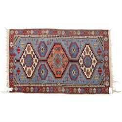 Caucasian Kazak hand-knotted rug, pale blue main field with large geometric medallions in ...