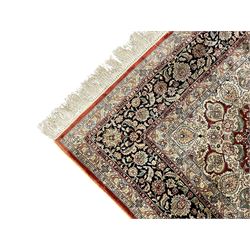 Persian silk finely knotted rug, central floral rosette medallion surrounded by curling branches decorated with palmettes, repeating pattern borders decorated with stylised plants and trailing leafy branches  