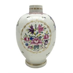 Mid 18th century Worcester tea caddy or teapoy, of oviform, painted in polychrome enamels with a reserve of flowers within a gilt foliate border, the body further detailed with conforming floral sprays and sprigs, beneath a puce band, H13.5cm