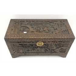  Eastern carved camphor wood blanket box depicting village scene, W94cm, H49cm, D45cm   