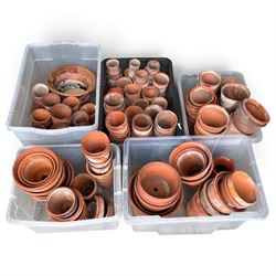 Large collection of vintage terracotta flowerpots of varying traditional forms and graduat...