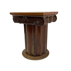 Victorian mahogany vanity unit in the form of a column, the scrolled top with hinged lid revealing mirror, wash bowl and toiletry dishes, on scalloped cylinder pedestal with single door, the interior fitted with shelf
