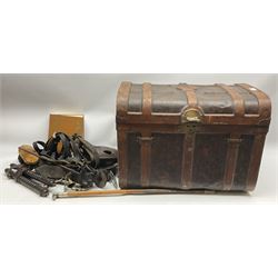 Metal trunk H46cm L62cm, alongside riding whip with dog topper, the book of the horse, rutters horse twitch, a selection of horse bits, horse brasses, parts of leather bridle, etc. 