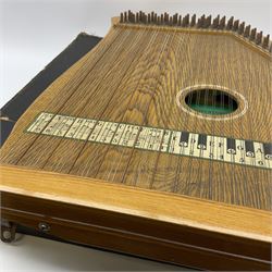Supertone Stringed Accordian by Abbley & Son London with simulated oak finish and transferred keyboard, no.169, L52cm, in carrying case with sheet music