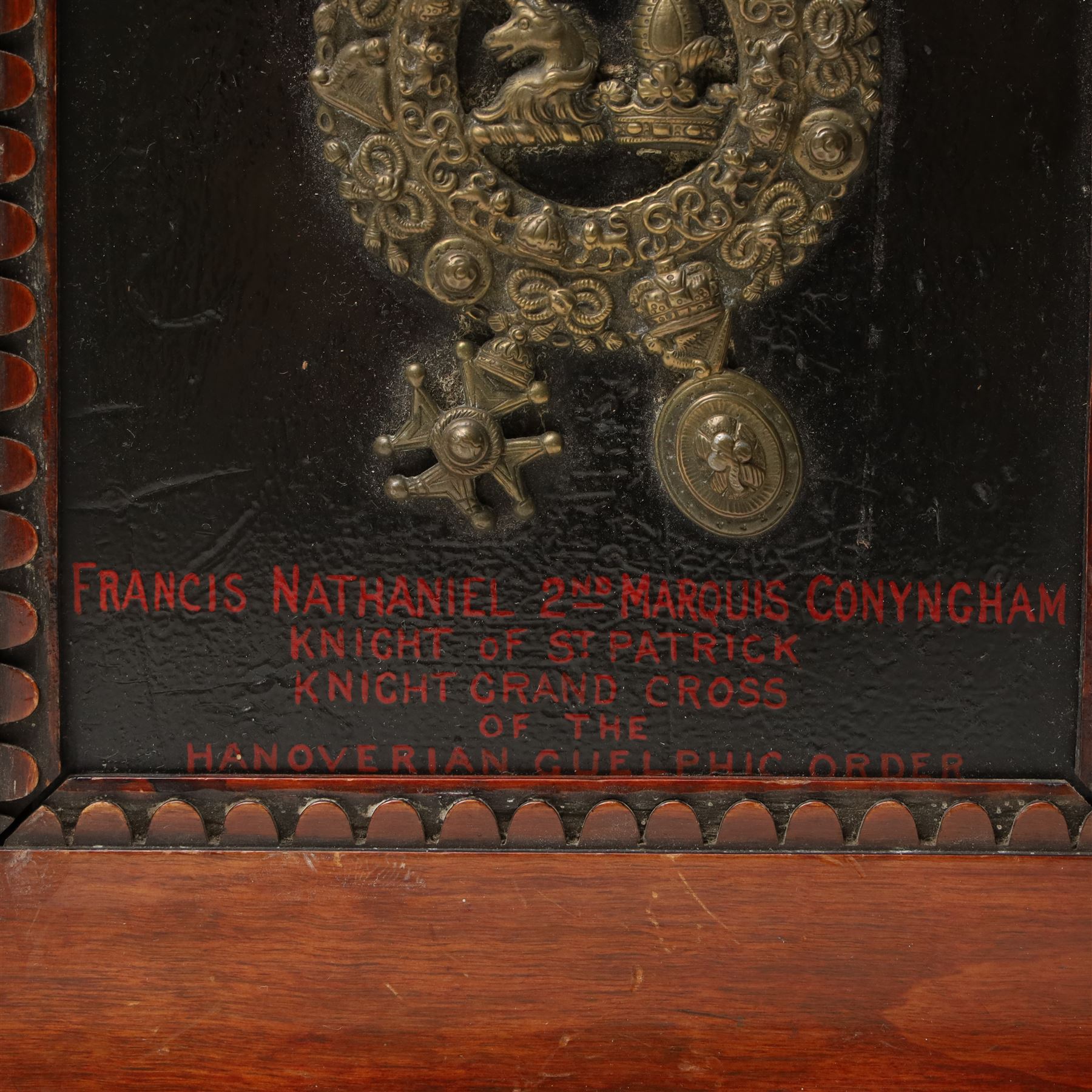 19th century brass coach plate with the arms of Conyngham, inscribed 'Francis Nathaniel 2nd Marquis Conyngham, Knight of St Patrick, Knight Grand Cross of the Hanoverian Guelphic Order', framed and with hand written information to the reverse 26cm x 21cm overall