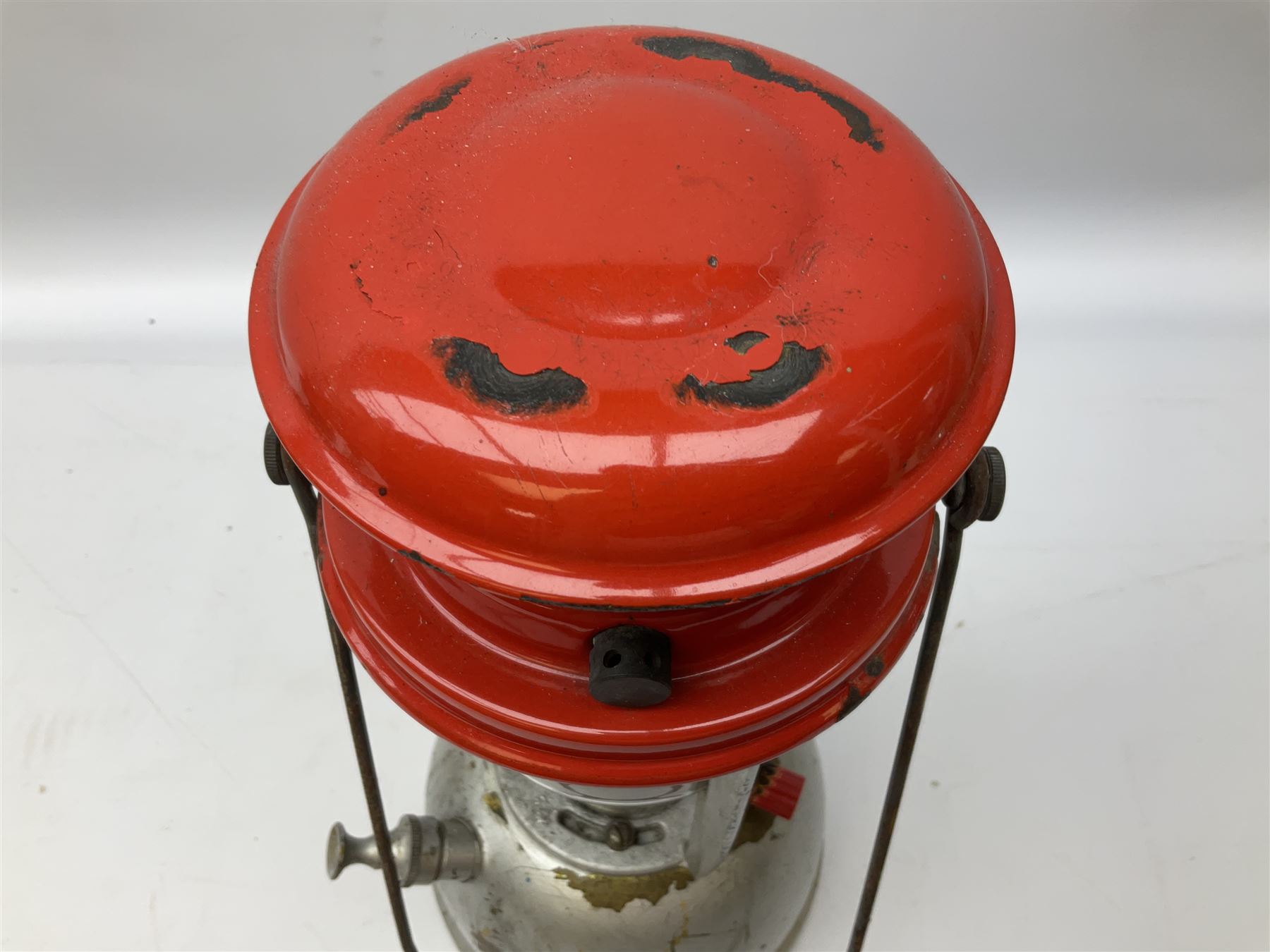 Copper and brass ship’s lamp marked ‘Anchor’, H25cm, Feuer hand storm lantern, Bialaddin Model 315 paraffin lamp and an Anchor lamp (4)