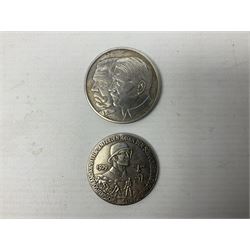 Four post-WW2 'silver' medallions of Adolf Hitler/German interest, two depicting Von Hindenburg also; and pair of 1960s trench art shell case bases as ashtrays mounted with Libyan Five Milliemes coins as cigarette rests (6)