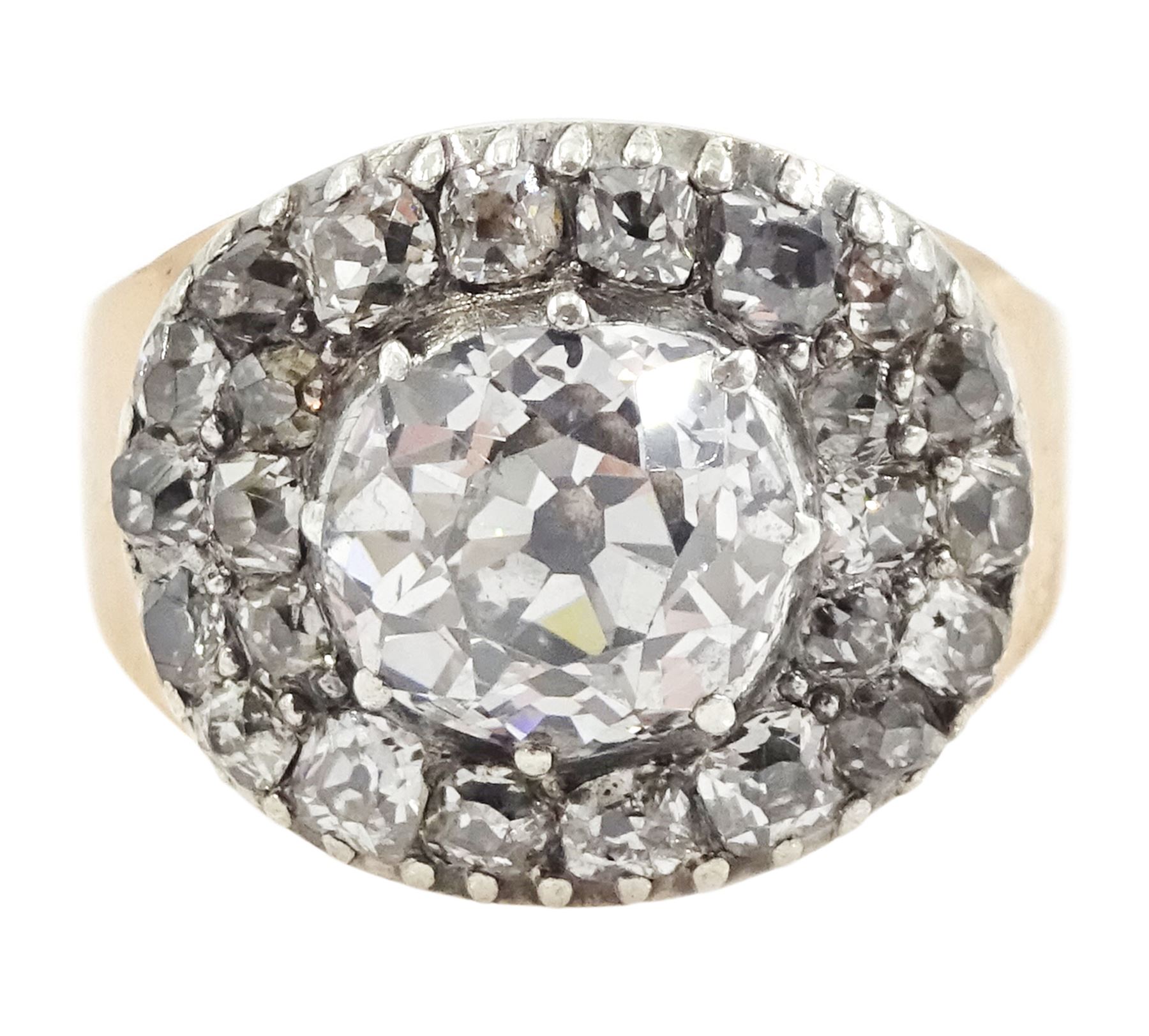 George III gold and silver old cut diamond cluster ring, the principal diamond of approx 0.75 carat, with pave set old cut diamond surround
