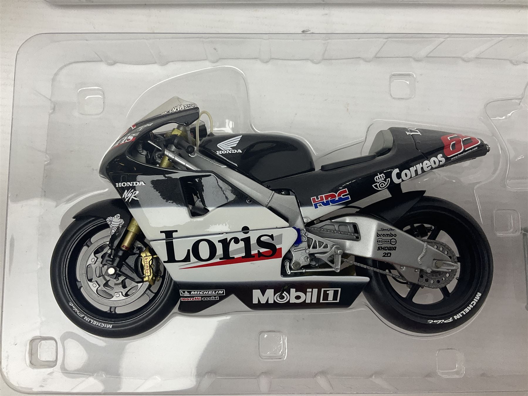Three Minichamps 1:12 scale die-cast models of motorcycles - Suzuki GSX-R1000 Team Alstare Suzuki Corona Extra Troy Corser WSB 2005; Yamaha YZR-M1 Gauloises Yamaha Team Colin Edwards MotoGP Laguna Seca 2005; and Honda NSR 500 Loris Capirossi MotoGP 2002; all boxed (3)